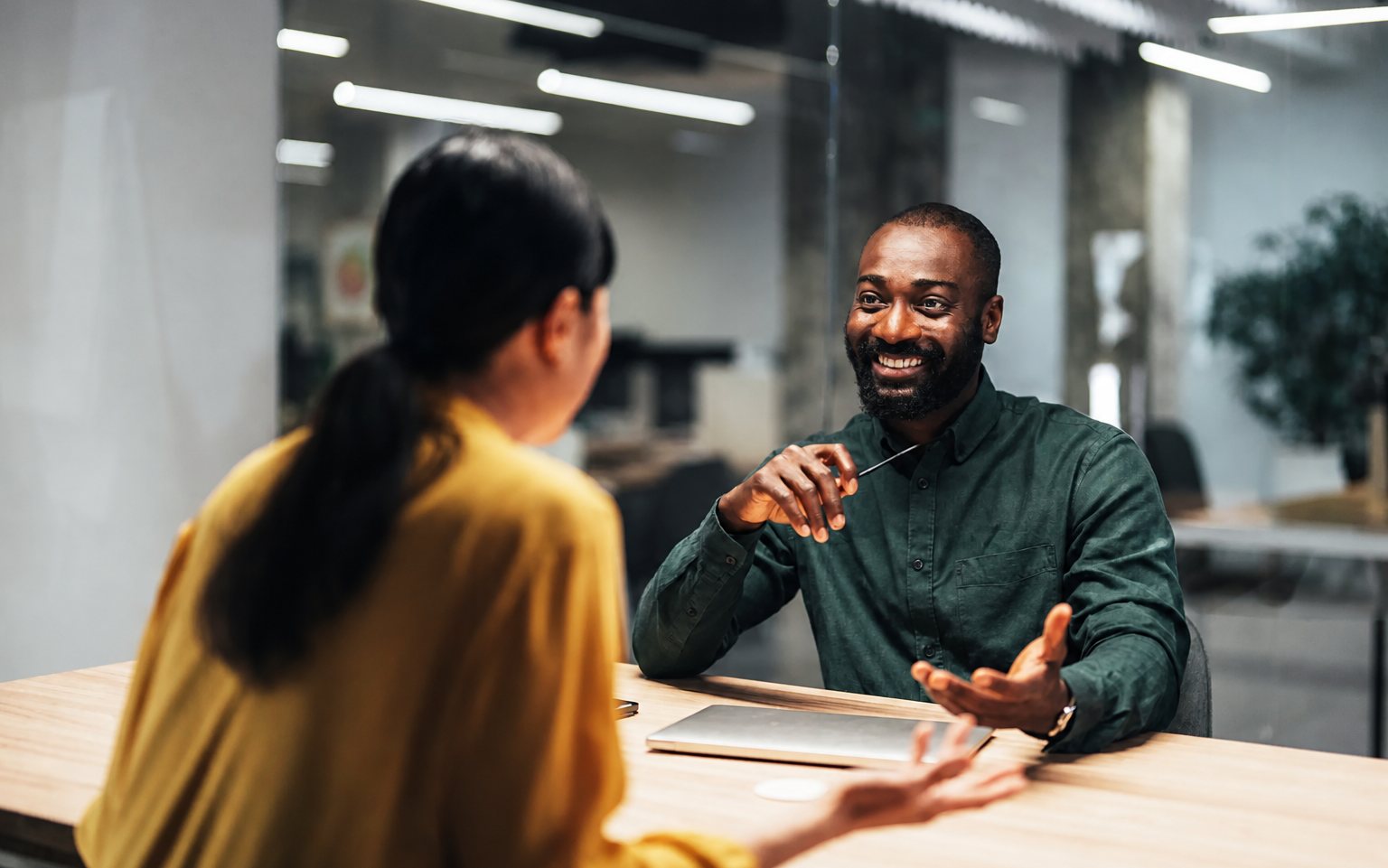 A financial adviser speaking with a client